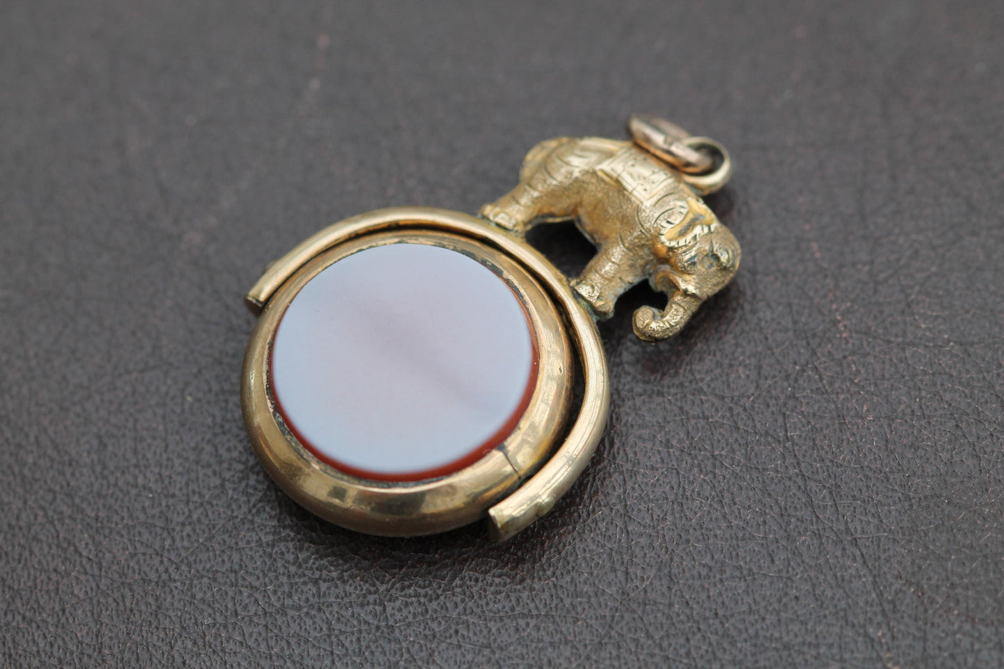 Antique-Victorian-9ct-Rolled-Gold-Spinner-Pendant,-Compass-&-Sardonyx-with-Elephant-Motif-c.1900s
