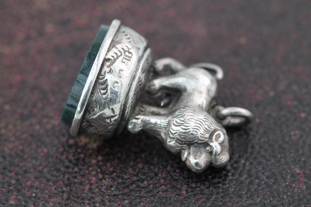 Antique-Sterling-Silver-Lion-Mounted-Pendant,-1898