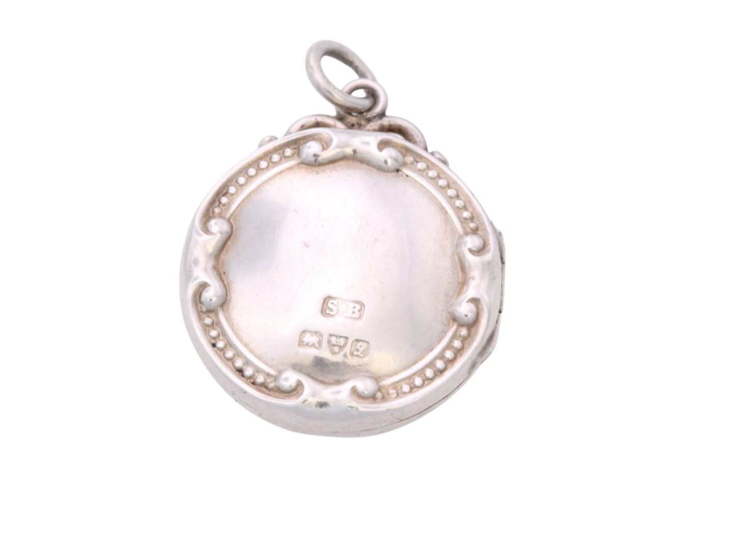 Reverse of antique Chester silver locket showing 1911 hallmarks