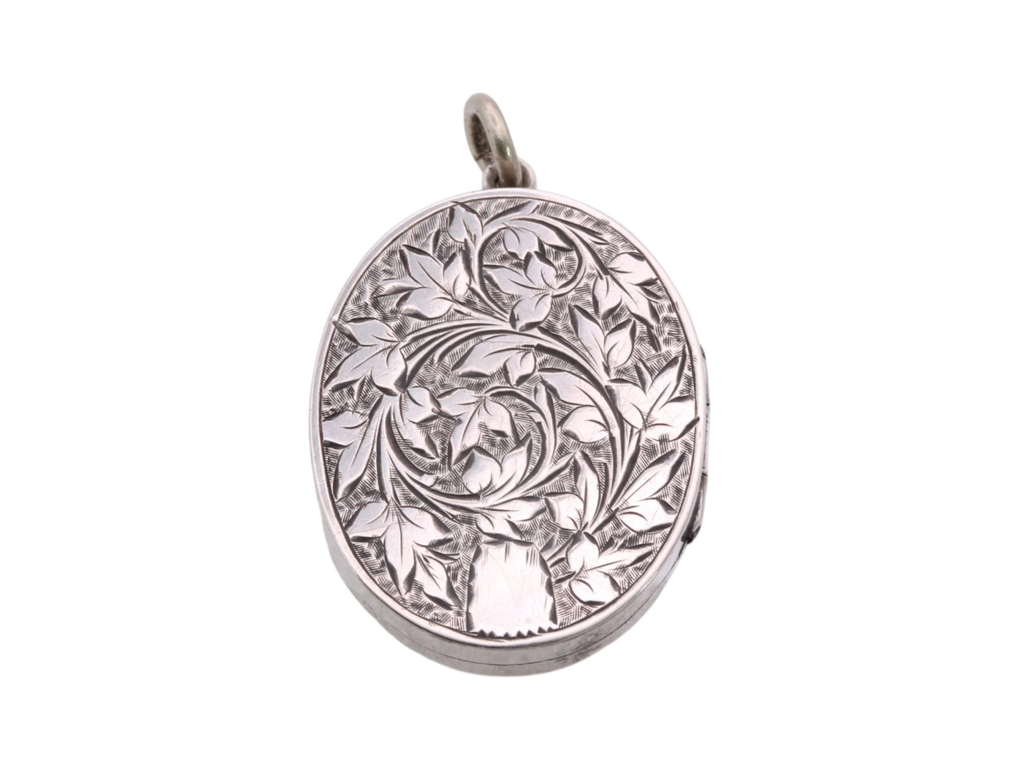 Reverse of Victorian sterling silver locket with hand engraved leaf and scroll decoration