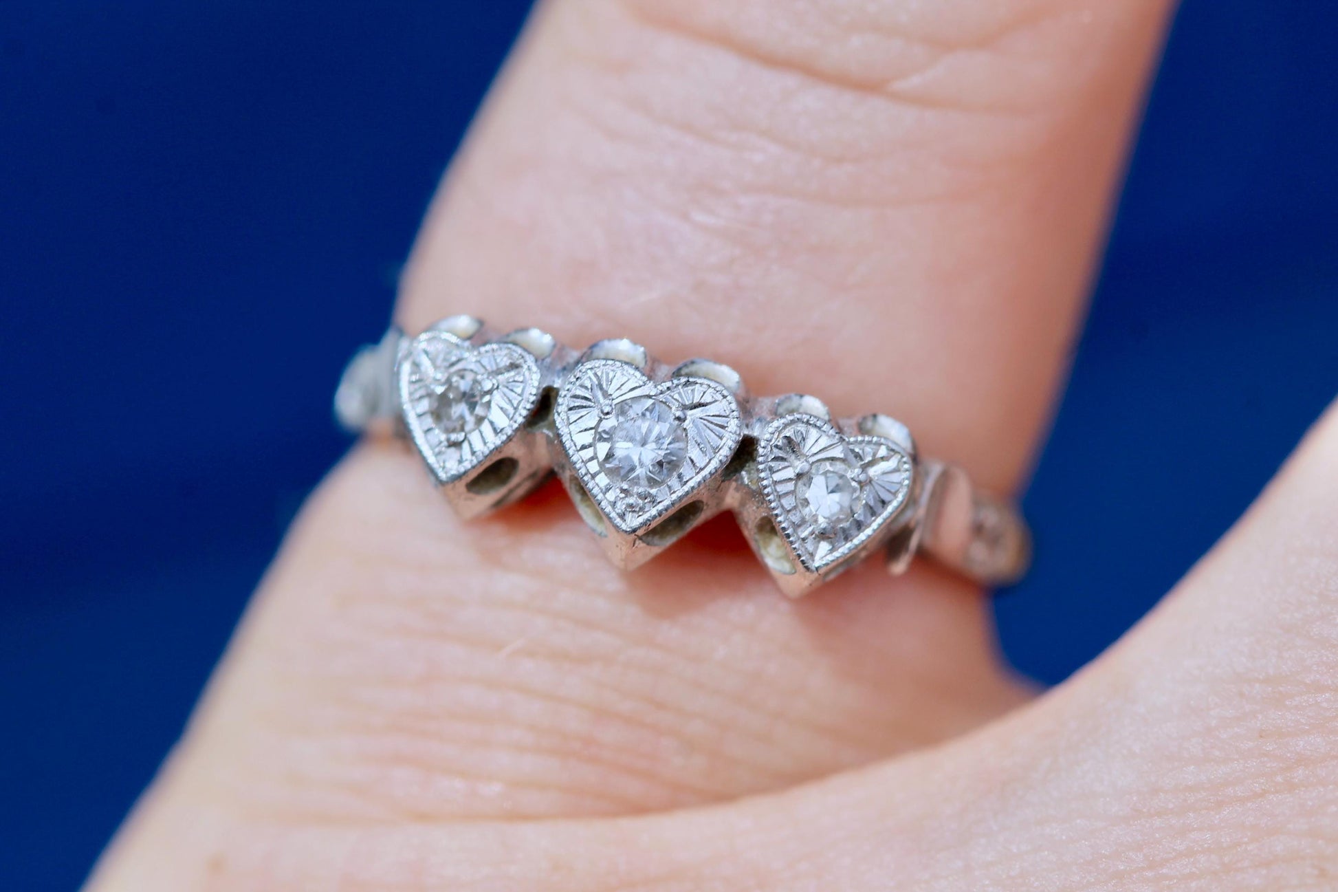 Reverse of Art Deco diamond ring showing three heart-shaped openings