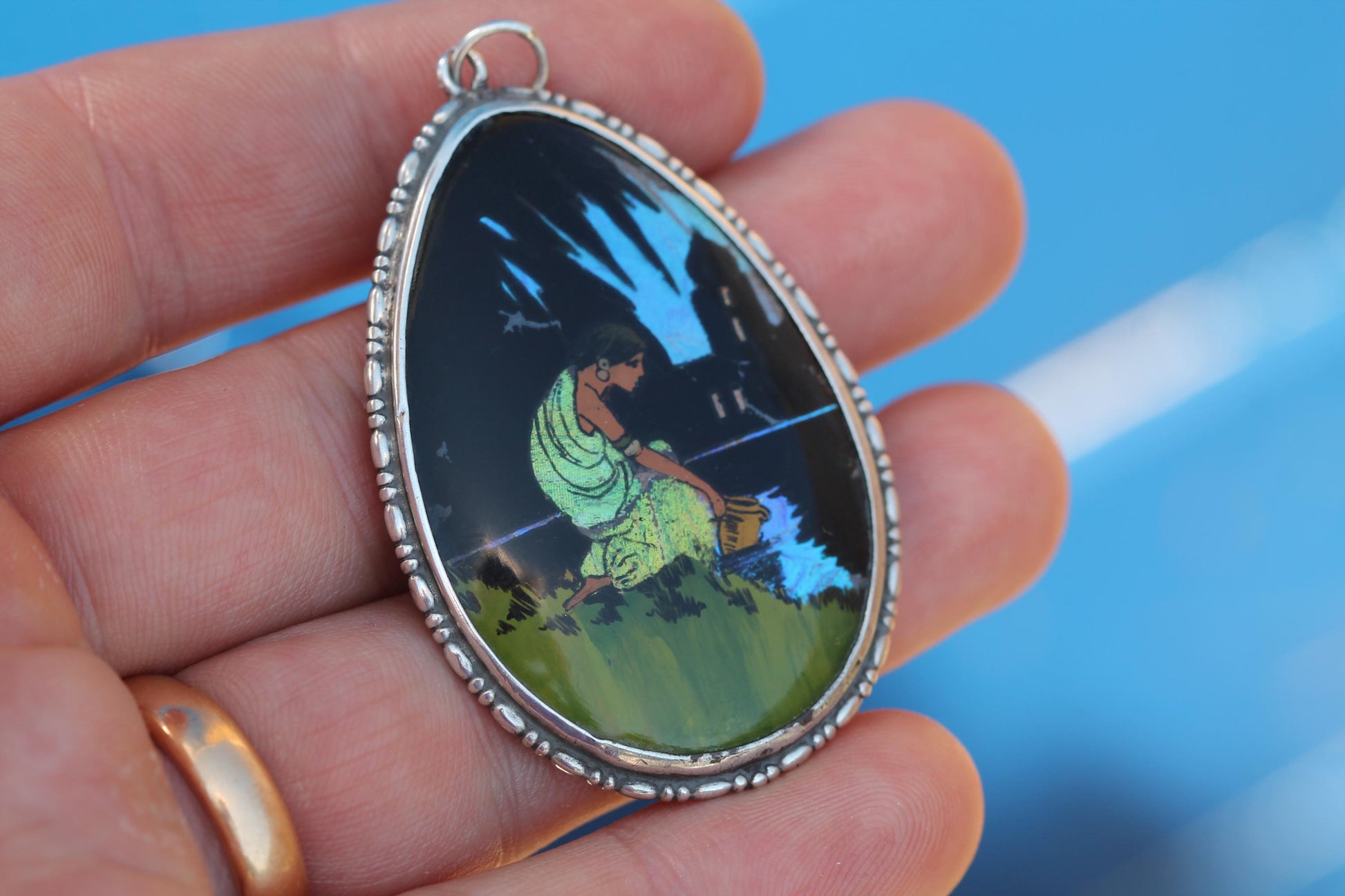 Art Deco sterling silver teardrop pendant with painted female figure