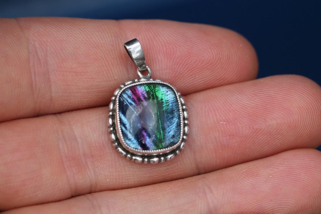 Reverse of sterling silver butterfly wing pendant showing the second butterfly wing panel
