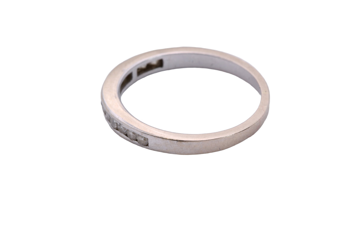 Side view of slim diamond half eternity ring