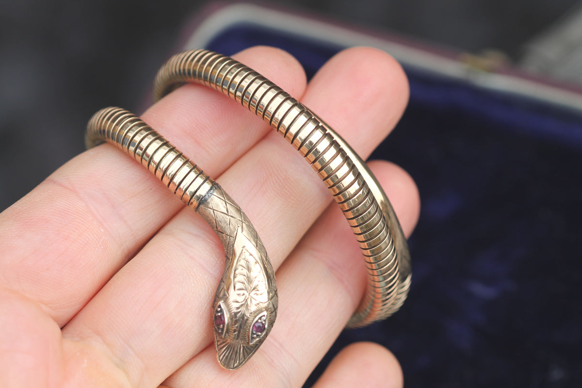 Side view showing flexible coiled snake body