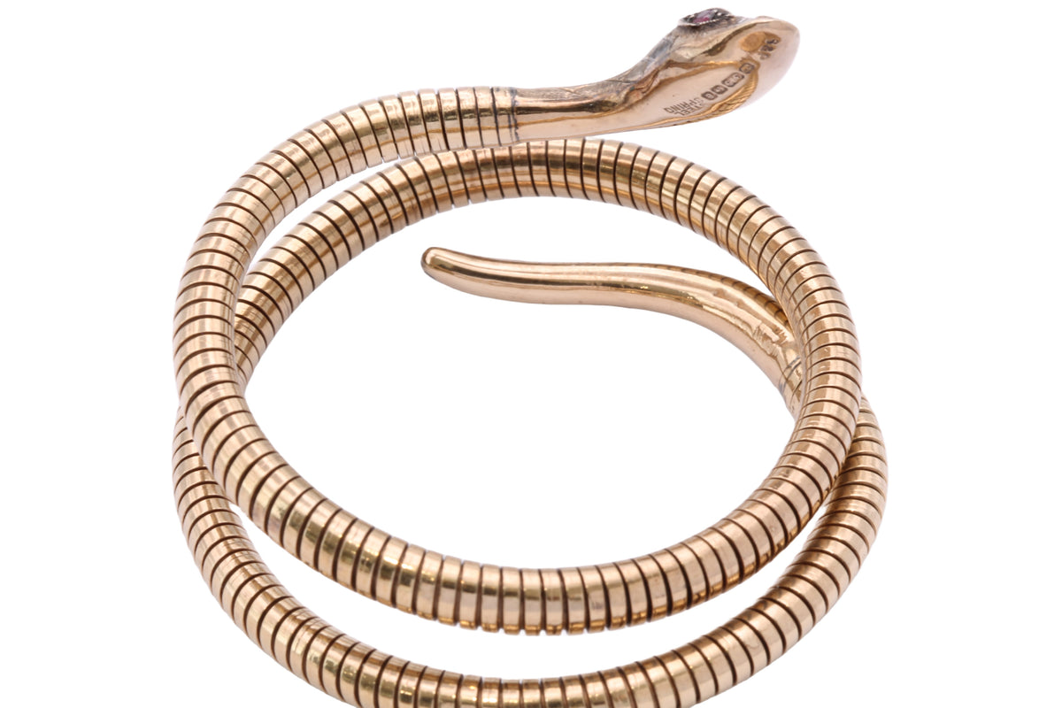 Close-up of engraved snake head and STEEL SPRING stamp
