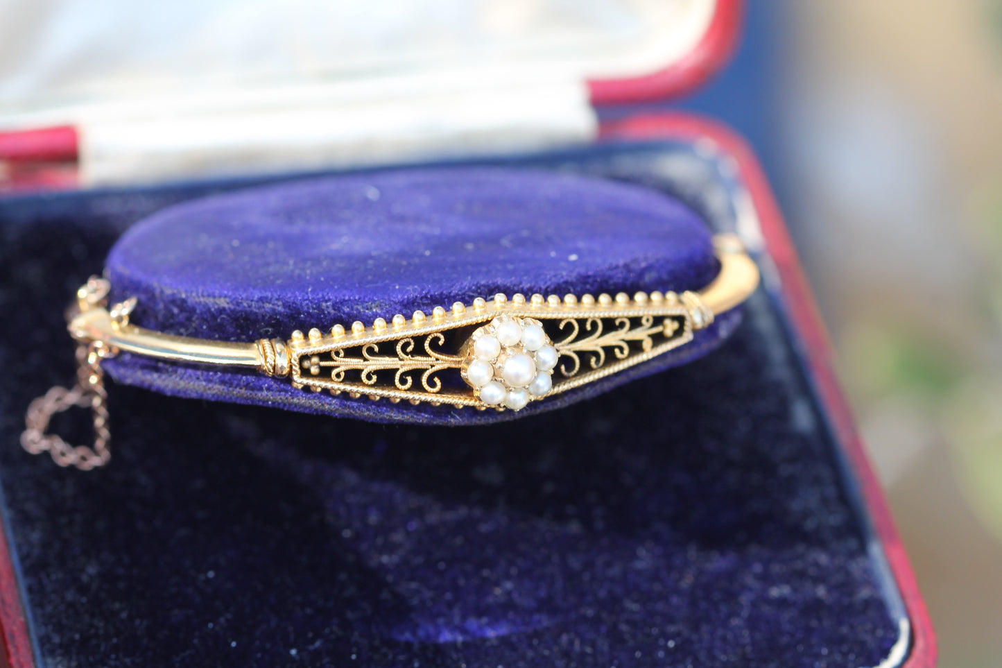 Antique Edwardian 15ct gold bangle with pearl cluster and openwork decoration