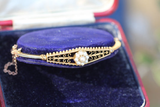Antique Edwardian 15ct gold bangle with pearl cluster and openwork decoration