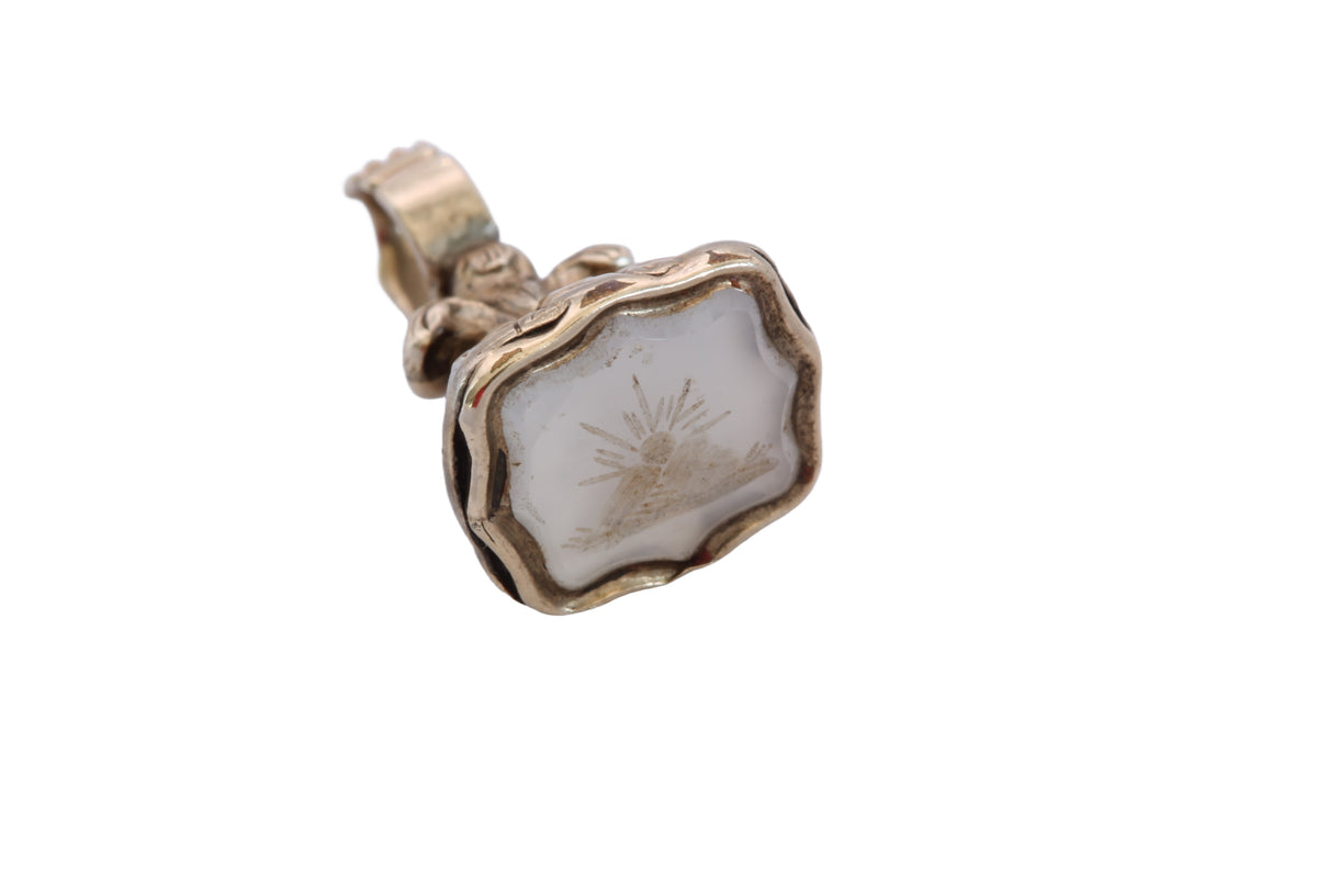 Reverse of antique gold cased seal showing decorative foliate detail