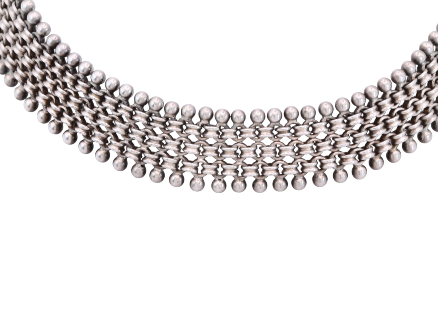 Close-up of antique Victorian sterling silver collar necklace with beaded edging