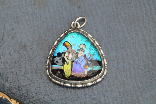 Art Deco sterling silver butterfly wing pendant with painted figural scene