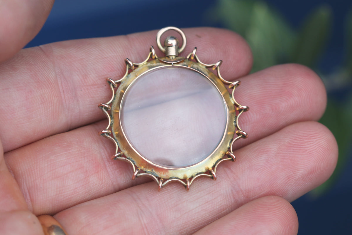 Reverse of antique 9ct gold spider web locket frame