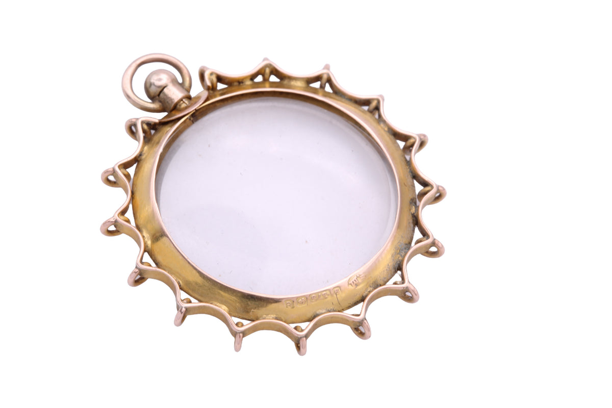 Edwardian gold glass locket showing removable circular panels