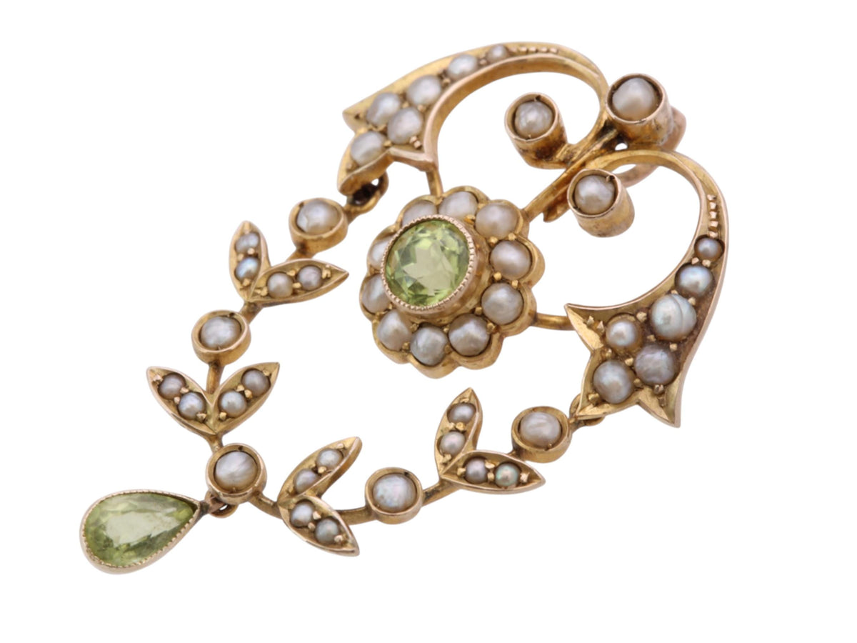 Edwardian pendant held in hand showing articulated lower section