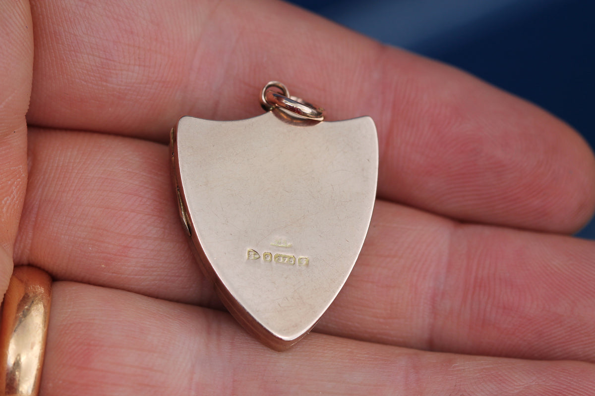 Open Edwardian locket showing original glass and insert