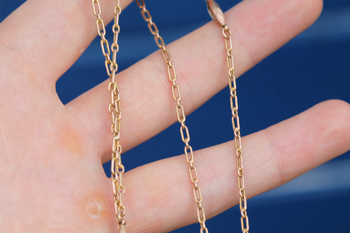 Antique 9ct gold trombone link long guard chain with faceted tab links