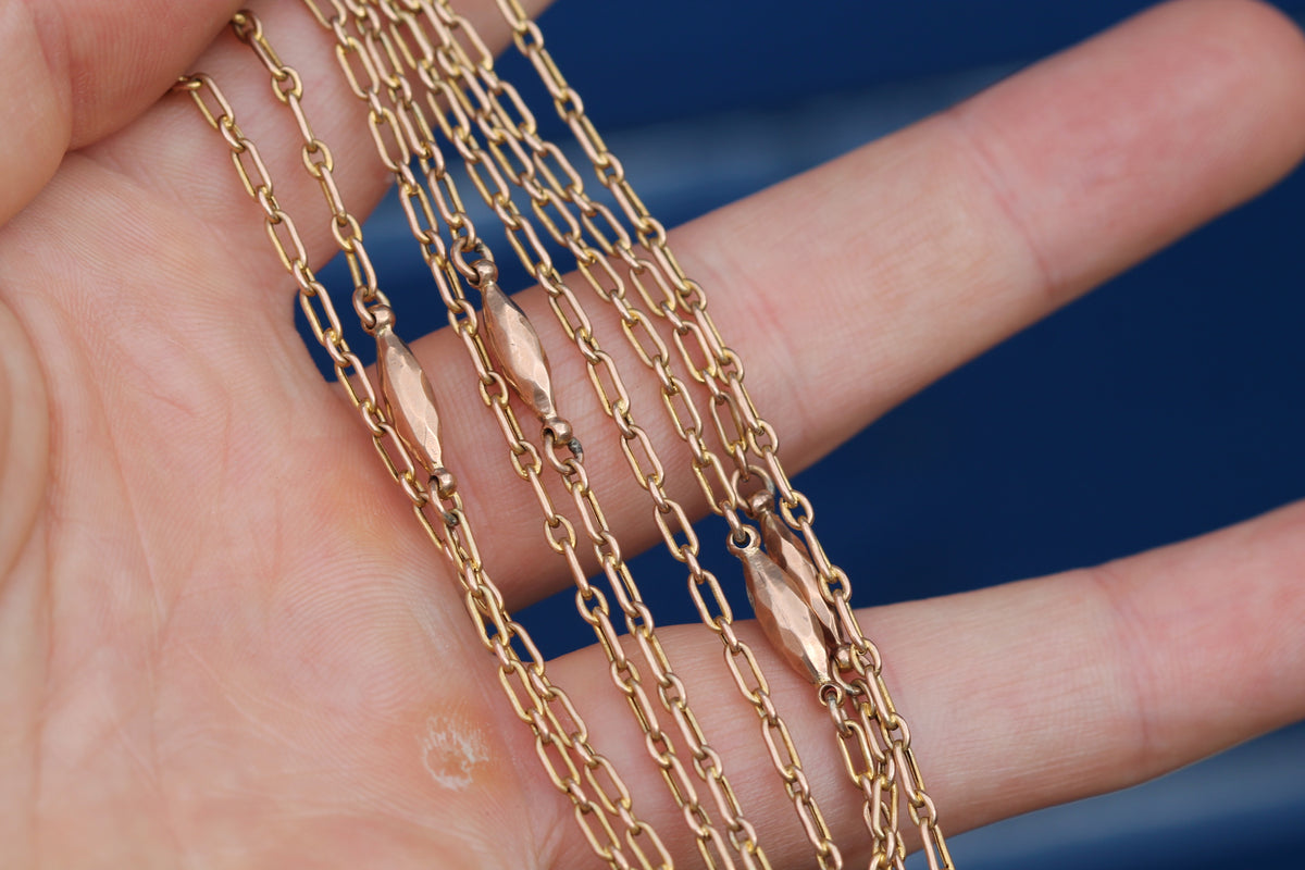 Antique trombone long guard chain showing original 9ct gold dog clip