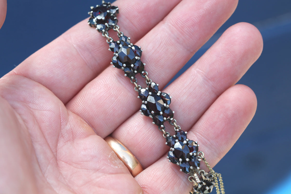 Close-up of NORM stamp to antique garnet bracelet clasp