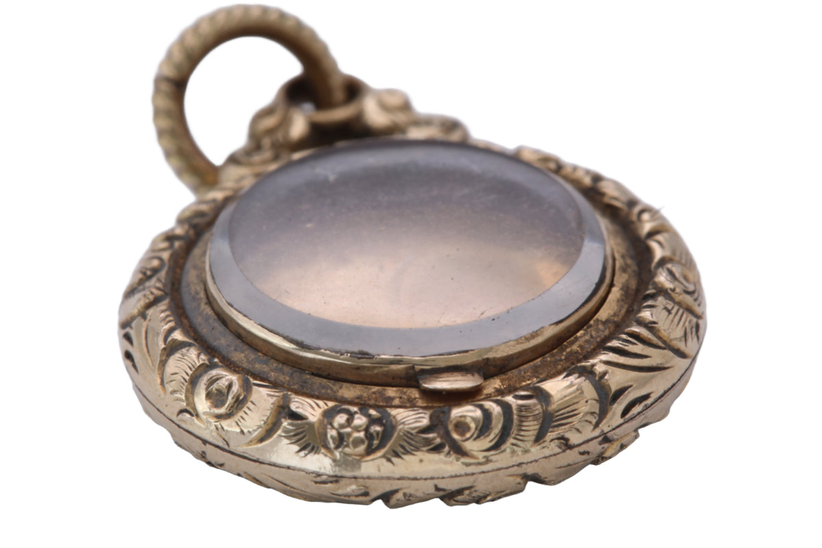 Open antique Georgian locket showing original internal glass panel