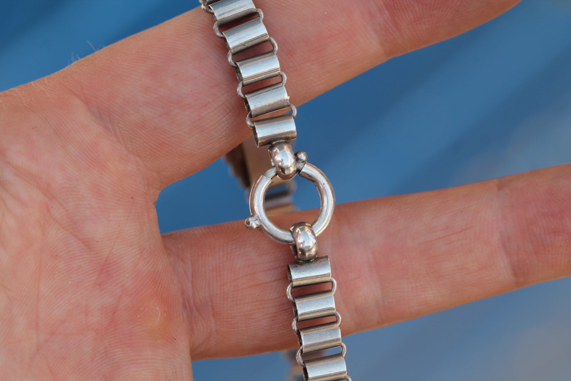 Victorian silver necklace showing articulated links and decorative engraved plaques