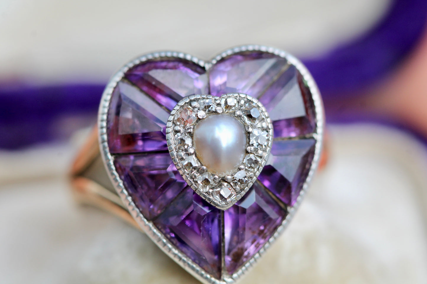 Side view showing raised silver gemstone setting on antique 22ct gold ring