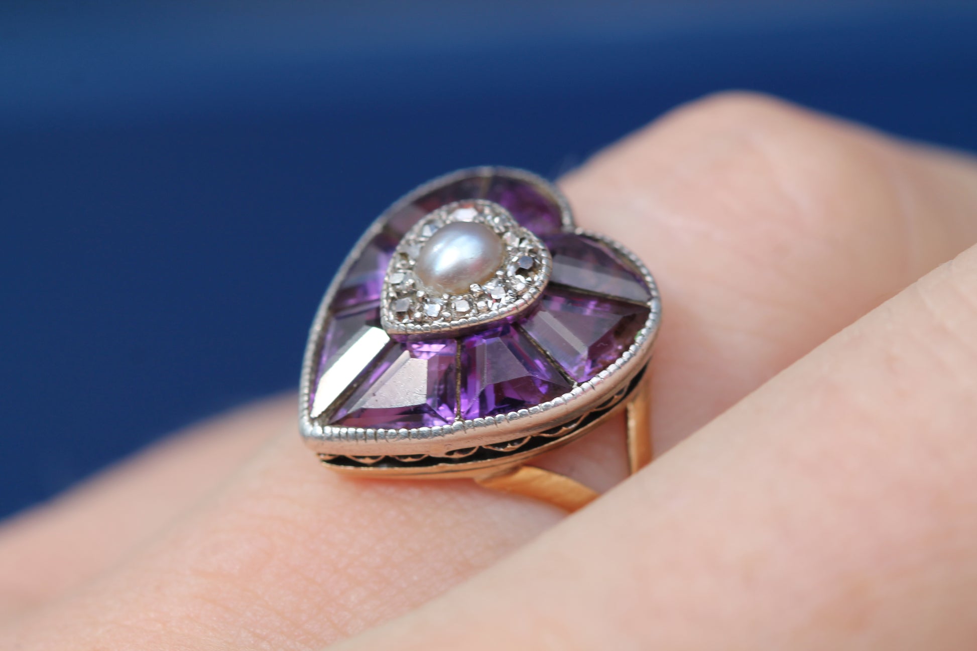Antique amethyst pearl and diamond heart ring worn on the finger