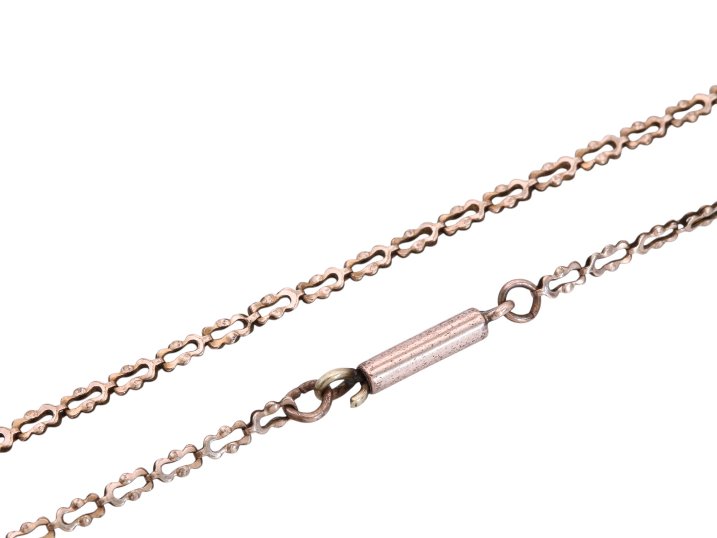 Close-up of antique rolled gold necklace showing openwork link pattern