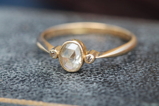 Antique Victorian 18ct gold rose cut diamond three stone ring worn on the finger