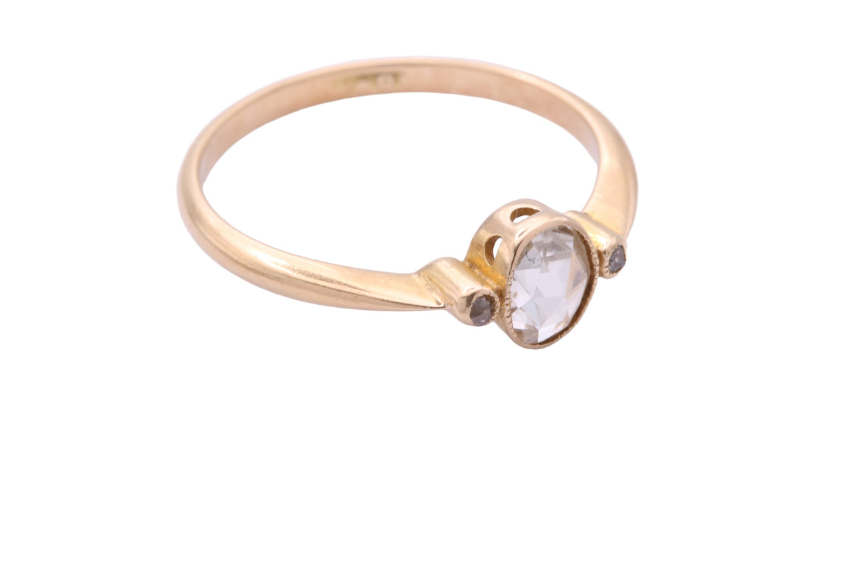 Close-up of antique rose cut diamond ring showing centre and side stones