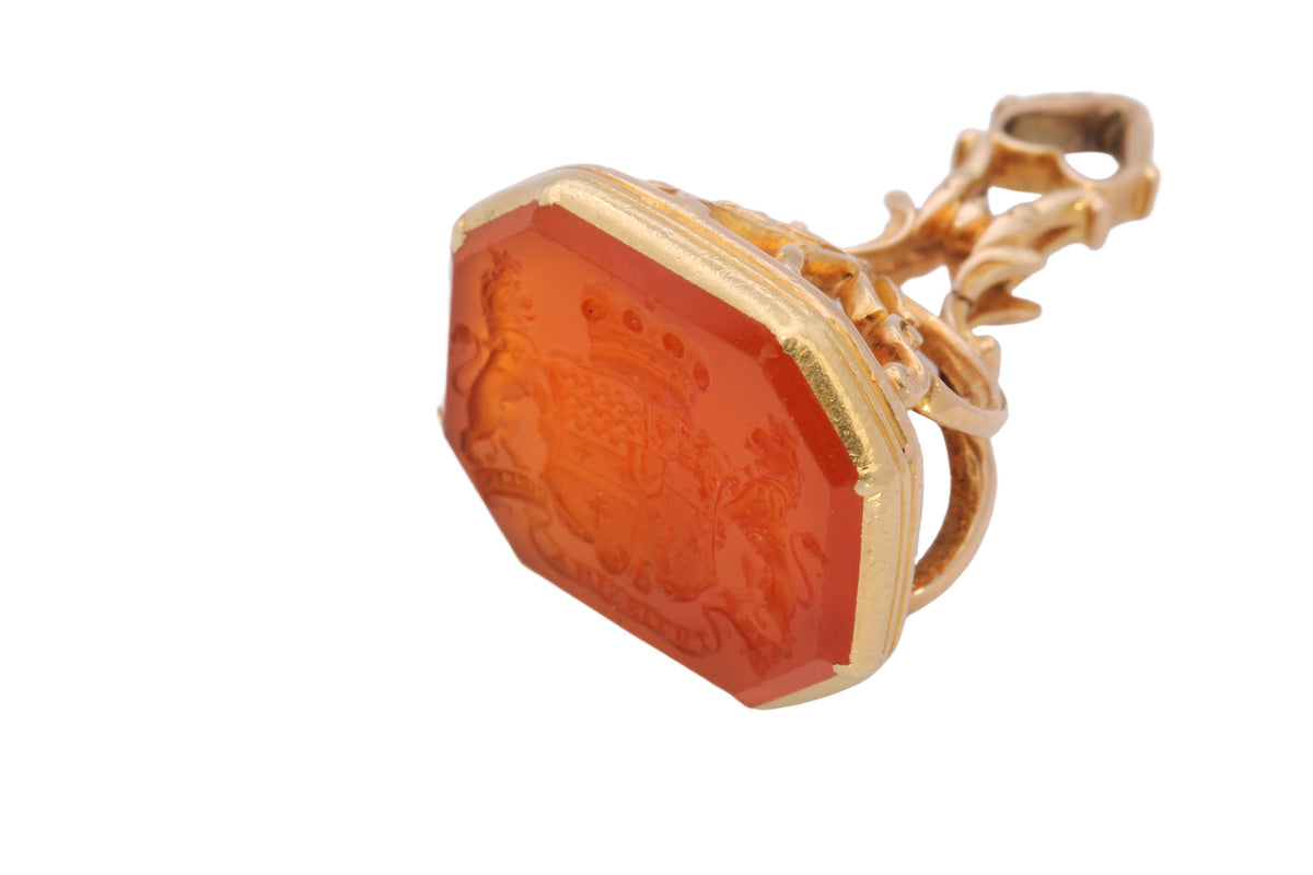 Close-up of carnelian seal engraved with crowned shield and lion supporters