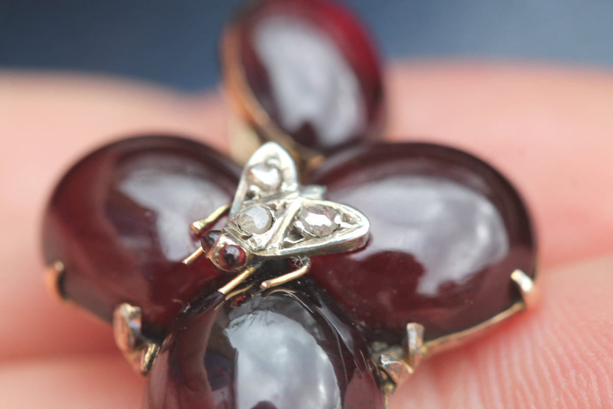 Antique pendant with four large cabochon garnets arranged as a flower