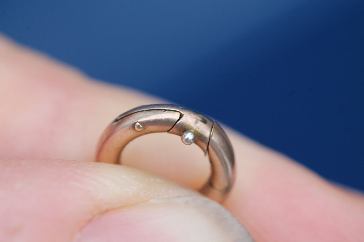Front view of small antique 9ct gold circular spring clasp