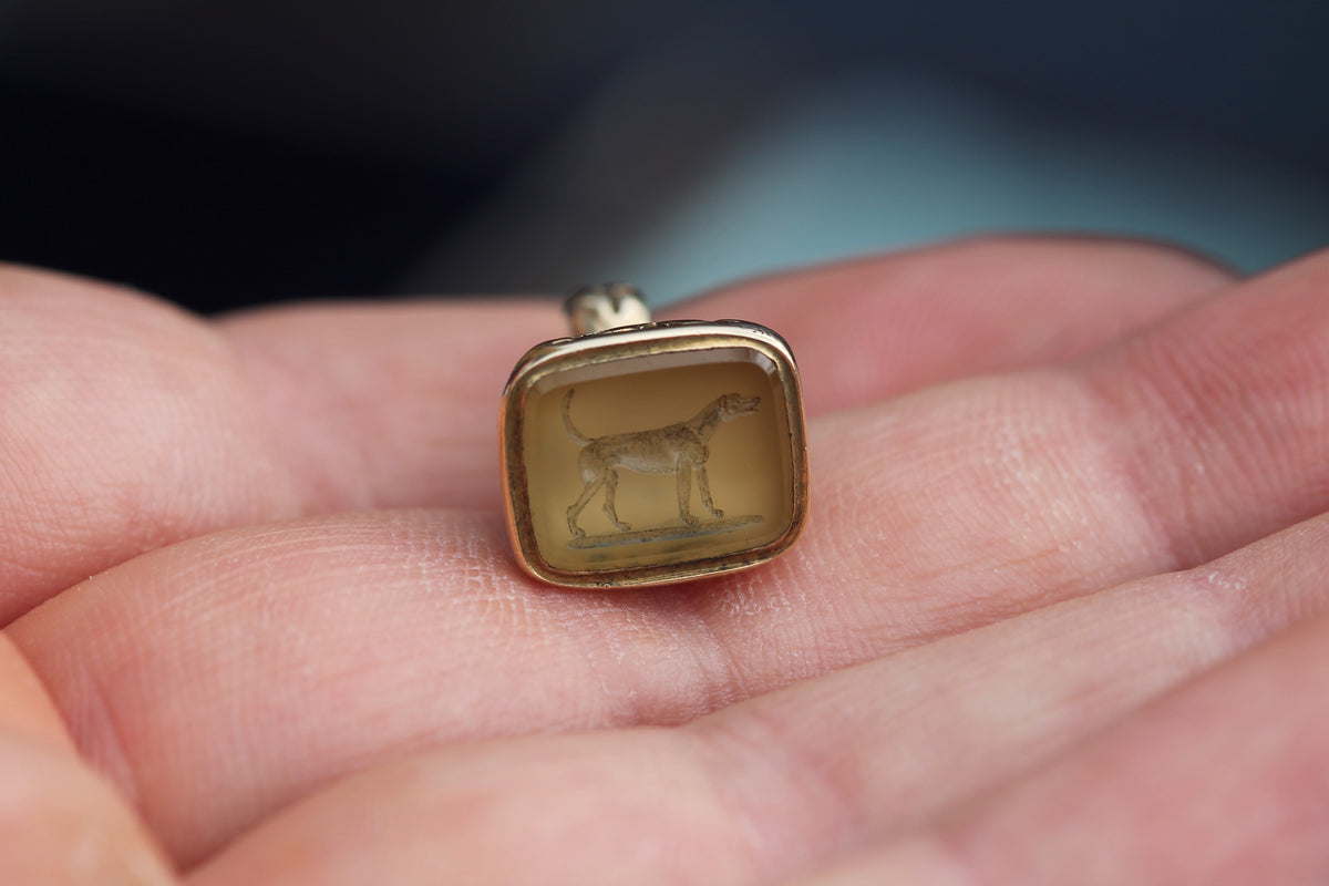 Side view of antique chalcedony intaglio seal showing sculptural foliate detail