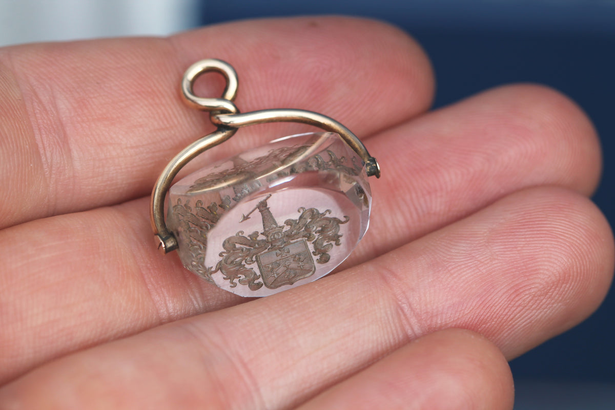 Victorian 9ct gold intaglio fob showing arm holding an arrow above a shield