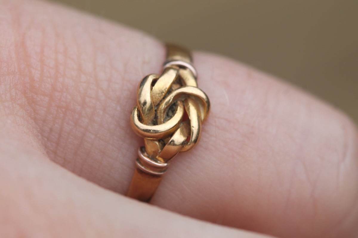 Side view of antique Birmingham 1870 gold knot ring showing hallmarks