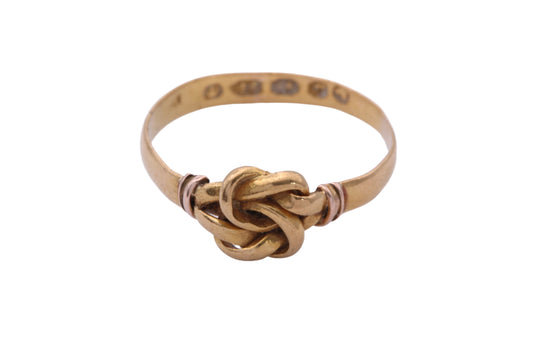 Antique Victorian 22ct gold love knot ring worn on the finger