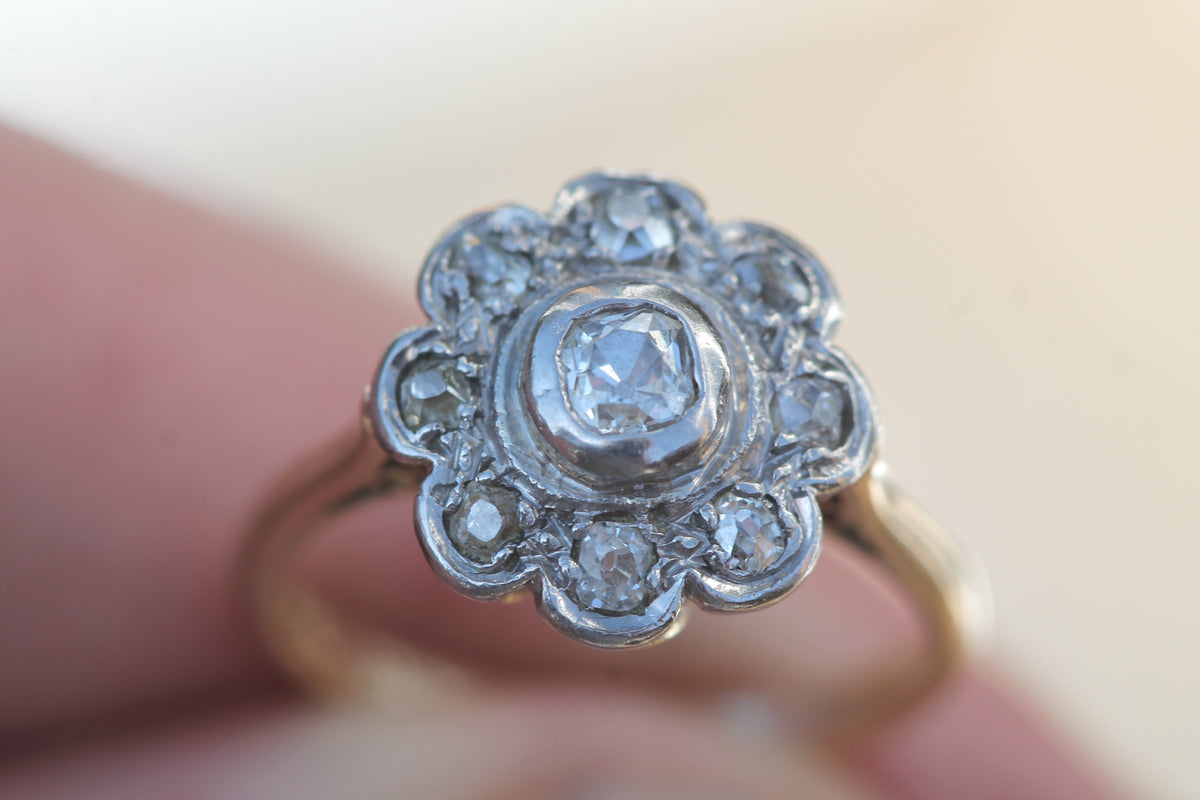 Reverse of Edwardian diamond ring showing open-backed flower setting
