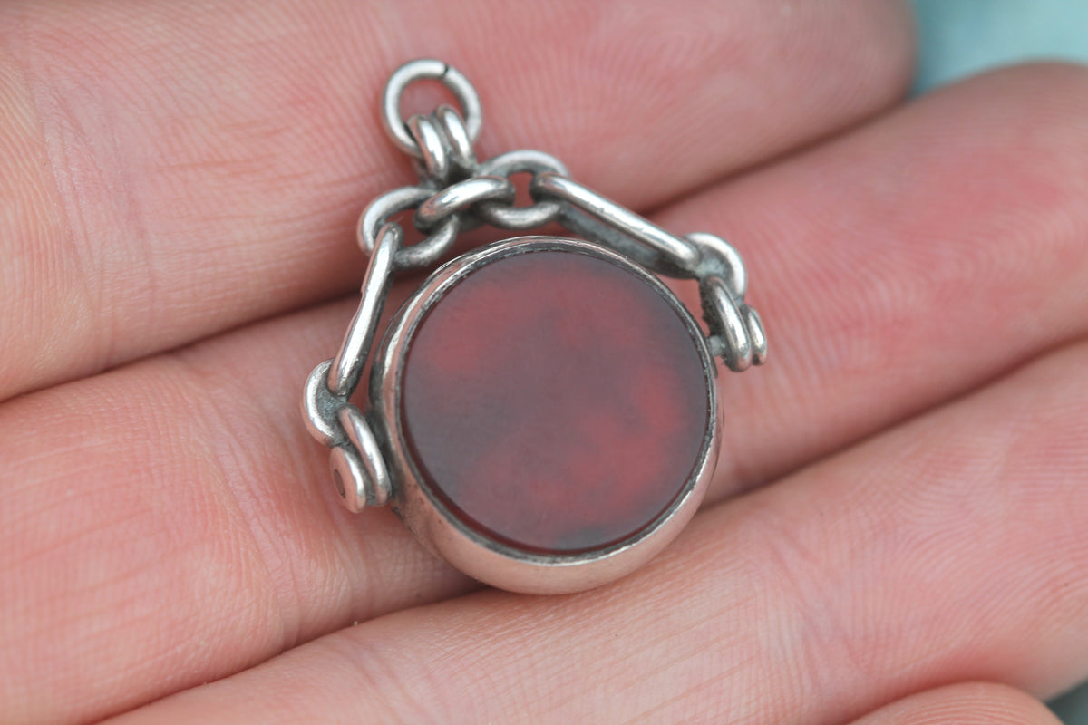 Carnelian side of antique silver spinner fob