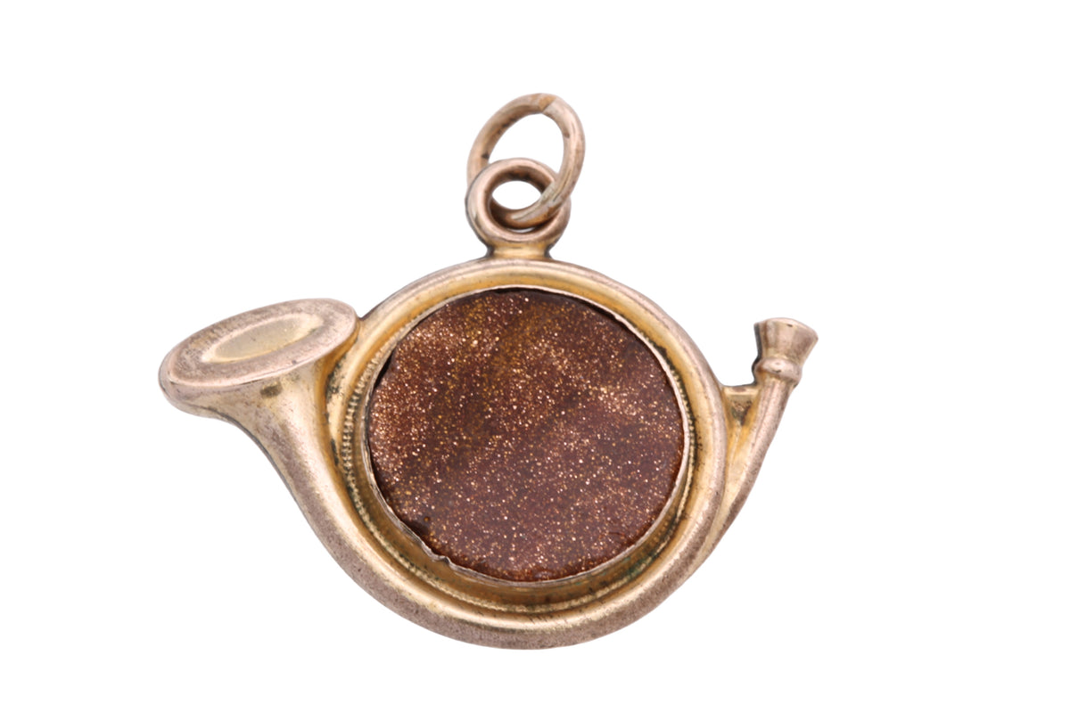 Reverse of Victorian hunting horn pendant showing circular goldstone panel