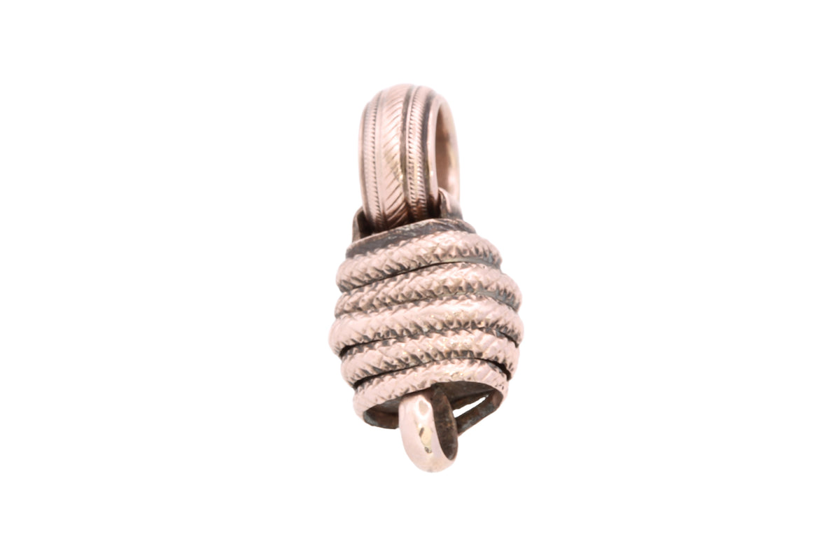 Reverse of Victorian snake connector showing tightly wrapped textured form