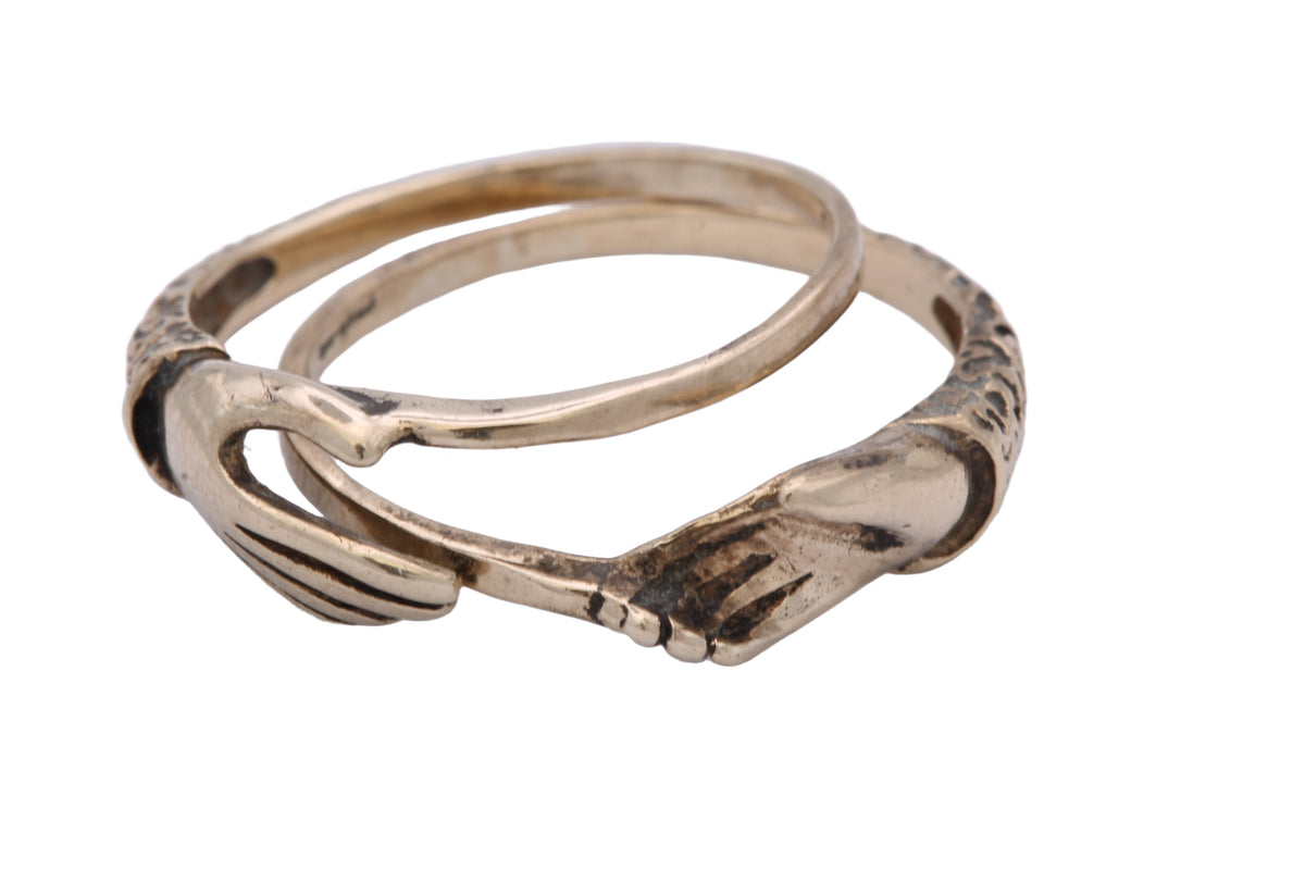 Two separate 9ct gold fede rings shown apart