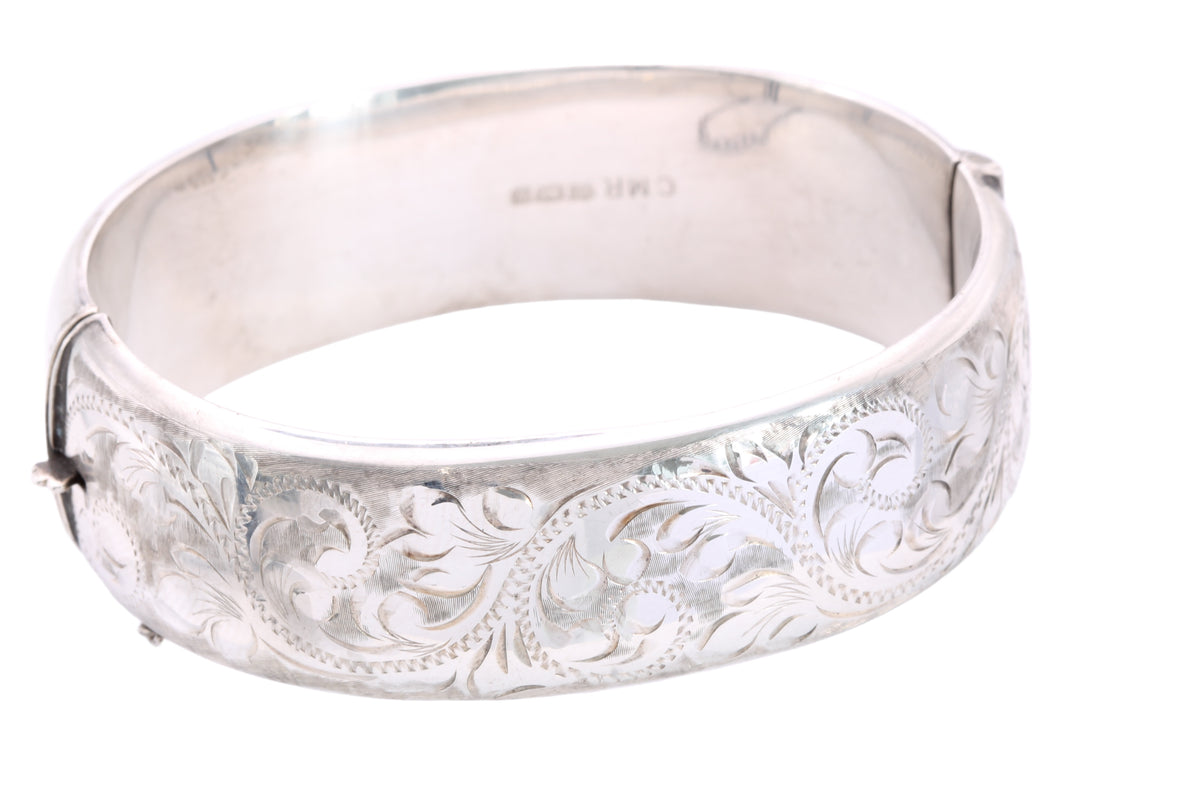 Vintage 1986 sterling silver bangle with detailed foliate engraving