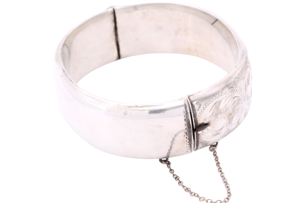 Full view of engraved sterling silver hinged bangle