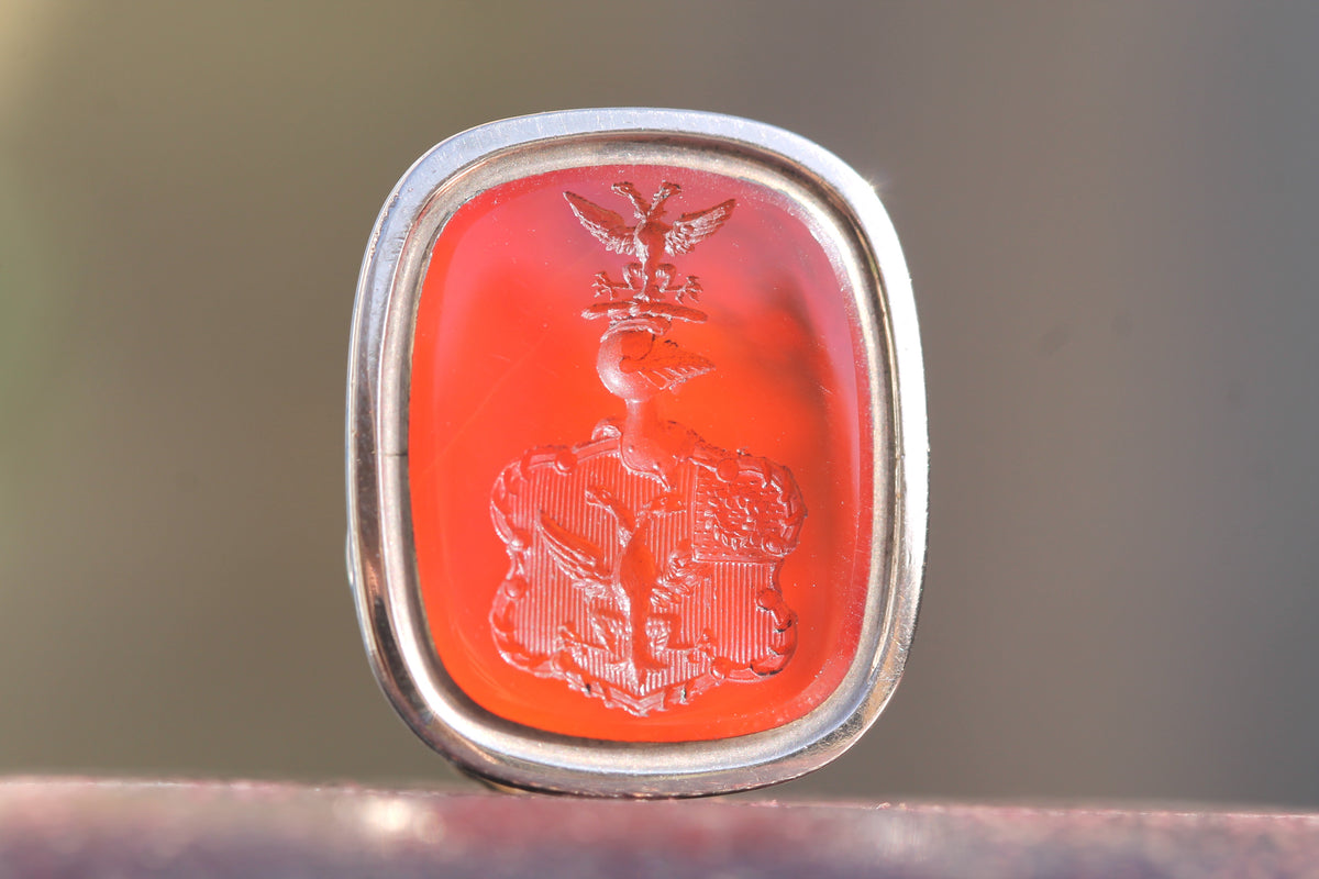 Close-up of working compass set into Victorian gold seal