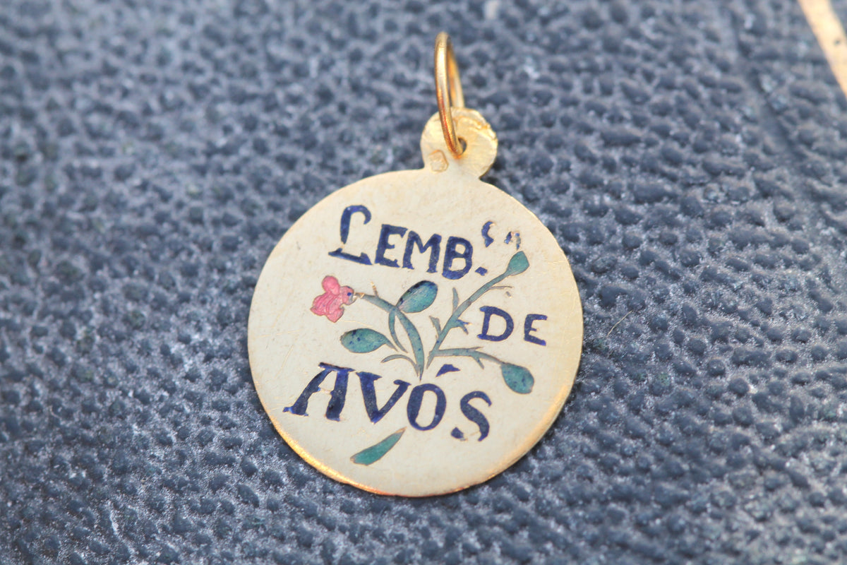 Small enamel grandparents keepsake charm held in hand
