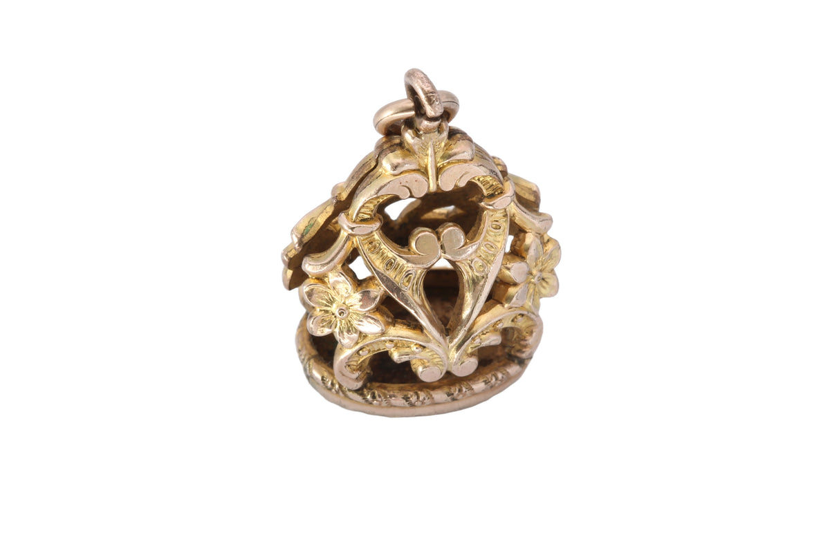 Side view of Victorian floral fob showing pierced scrollwork