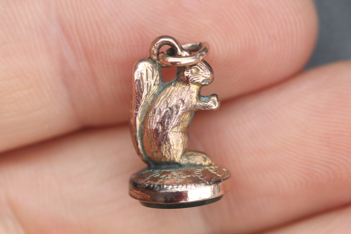 Close-up of miniature squirrel modelling and bloodstone base