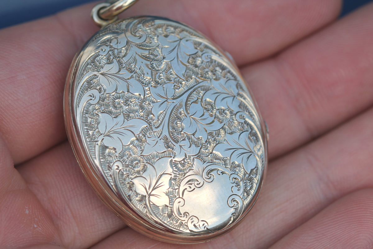 Open antique locket showing original glass and internal inserts