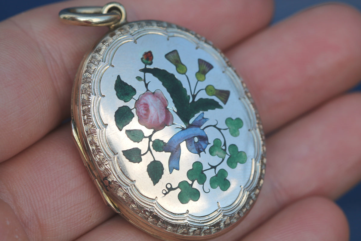 Reverse of Victorian locket with scrolling foliate engraving