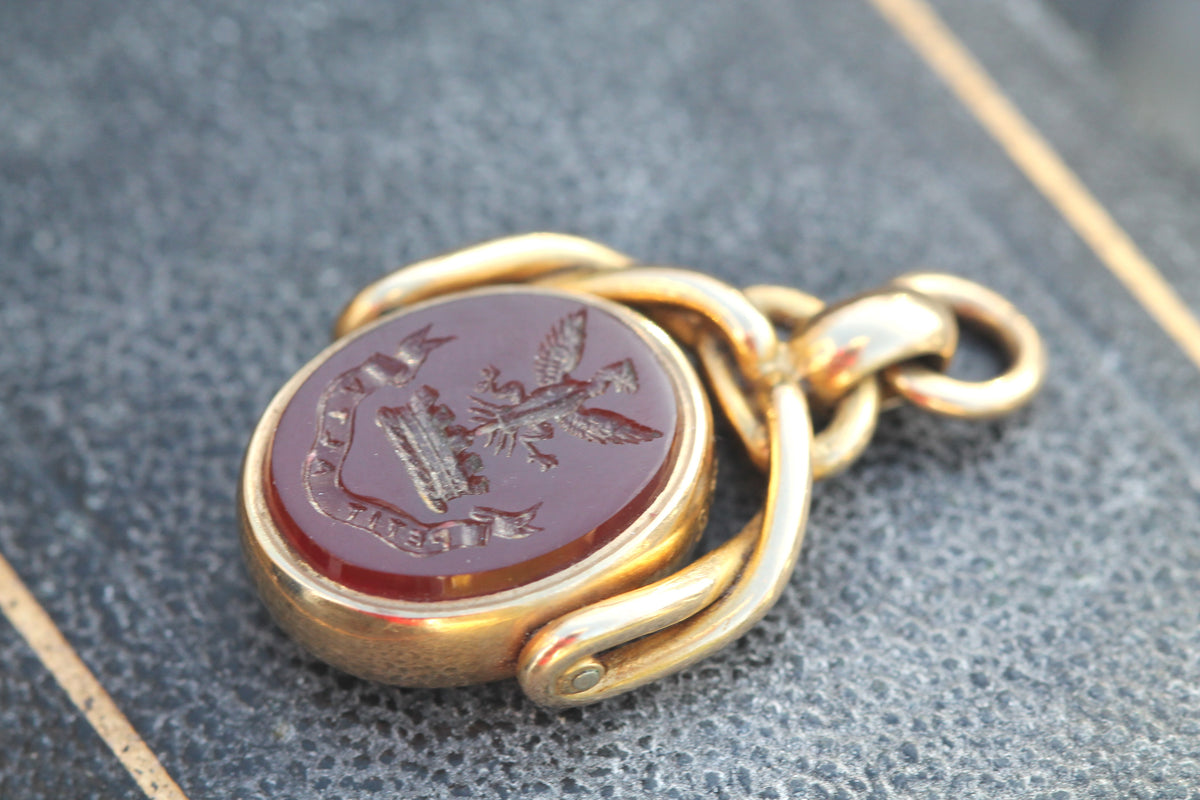 Carnelian intaglio engraved with rising phoenix and Petit Alta motto